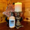 Goat milk hand soap with candle.